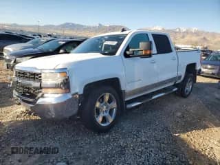 2016 Chevrolet Silverado 1500 LT with VIN 3GCUKREC4GG163842, listed as a Copart auction lot 82218595 with 100,157 mi miles and Salvage title. Bid and sale history available at DreamBid. Image 1.