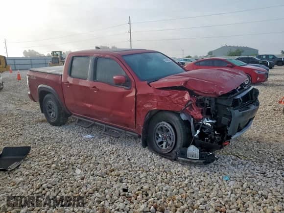 2025 Nissan Frontier Pro-X with VIN 1N6ED1EJXSN637854, listed as a Copart auction lot 65409335 with 2,410 mi miles and Salvage title. Bid and sale history available at DreamBid. Image 4.