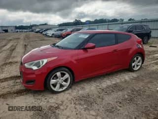 2013 Hyundai Veloster w/Black Int z VIN KMHTC6AD5DU173242, wystawiony jako Copart lot #64368995 z przebiegiem 157 766 mil mil oraz Czysty tytuł • Clean title. Historia ofert i sprzedaży dostępna na DreamBid. Obrazek 1.