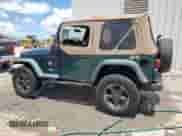 2000 Jeep Wrangler SE with VIN 1J4FA29P2YP800721, listed as a Copart auction lot 67490145 with 128,182 mi miles and Clean title. Bid and sale history available at DreamBid. Image 2.