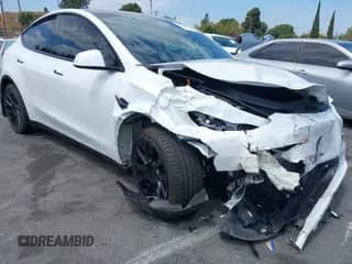 2023 Tesla Model Y Long Range with VIN 7SAYGDEE7PA124885, listed as a IAAI auction lot 43084065 with 22,983 mi miles and . Bid and sale history available at DreamBid. Image 1.
