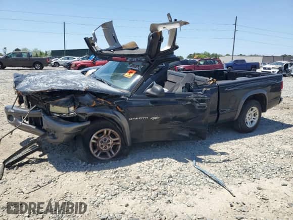 2002 Dodge Dakota с VIN 1B7GL12X92S578496, выставлен на аукционе Copart как лот 53506265 с пробегом Не указан миль и Списание • Salvage title. История ставок и продаж доступна на DreamBid. Изображение 1.