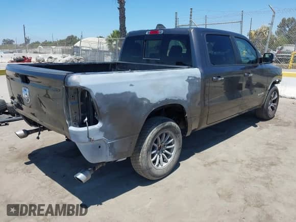 2019 Ram 1500 Laramie with VIN 1C6RREJT3KN894303, listed as a IAAI auction lot 42642439 with 84,379 mi miles and . Bid and sale history available at DreamBid. Image 4.