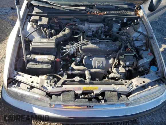 1990 Honda Accord LX with VIN JHMCB7651LC129028, listed as a Copart auction lot 82001875 with 158,454 mi miles and Salvage title. Bid and sale history available at DreamBid. Image 11.