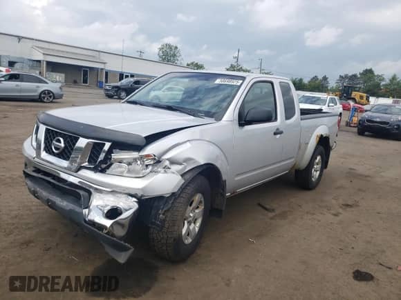 2009 Nissan Frontier SE with VIN 1N6AD06W79C408699, listed as a Copart auction lot 58698925 with 118,451 mi miles and Salvage title. Bid and sale history available at DreamBid. Image 1.