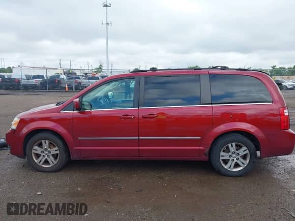 2010 Dodge Grand Caravan SXT with VIN 2D4RN5DX8AR477332, listed as a IAAI auction lot 42958371 with 295,542 mi miles and . Bid and sale history available at DreamBid. Image 14.