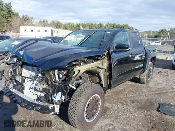 2024 Toyota Tacoma SR5 with VIN 3TMLB5JN0RM008463, listed as a IAAI auction lot 40979020 with 4,710 mi miles and . Bid and sale history available at DreamBid. Image 2.