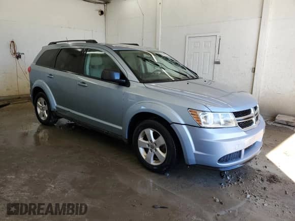 2013 Dodge Journey American Value с VIN 3C4PDCAB8DT576108, выставлен на аукционе Copart как лот 86882775 с пробегом 157 972 миль миль и Списание • Salvage title. История ставок и продаж доступна на DreamBid. Изображение 4.