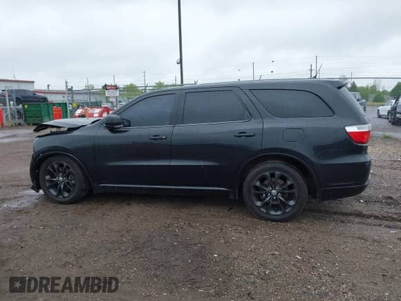 2013 Dodge Durango R/T with VIN 1C4SDJCT8DC638056, listed as a IAAI auction lot 42260663 with 201,316 mi miles and . Bid and sale history available at DreamBid. Image 14.