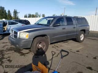 2006 Dodge Dakota ST with VIN 1D7HW28K96S716210, listed as a Copart auction lot 77416344 with 115,973 mi miles and Salvage title. Bid and sale history available at DreamBid. Image 1.