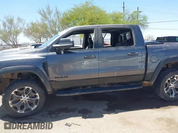 2022 Ram 1500 TRX with VIN 1C6SRFU97NN353587, listed as a IAAI auction lot 42174702 with 35,305 mi miles and . Bid and sale history available at DreamBid. Image 6.