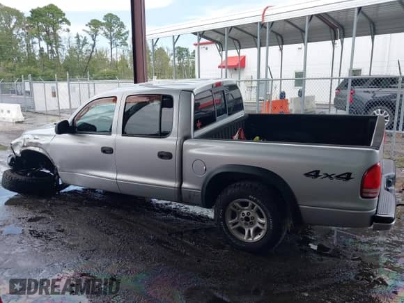 2003 Dodge Dakota Sport with VIN 1D7HG38N73S249488, listed as a IAAI auction lot 43033100 with 271,717 mi miles and . Bid and sale history available at DreamBid. Image 14.