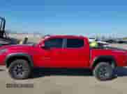2021 Toyota Tacoma SR z VIN 5TFCZ5AN0MX262902, wystawiony jako IAAI lot #43535009 z przebiegiem 70 926 mil mil oraz . Historia ofert i sprzedaży dostępna na DreamBid. Obrazek 13.