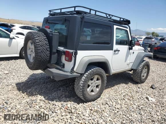 2011 Jeep Wrangler Rubicon with VIN 1J4BA6D12BL535953, listed as a Copart auction lot 59401595 with 77,451 mi miles and Salvage title. Bid and sale history available at DreamBid. Image 3.