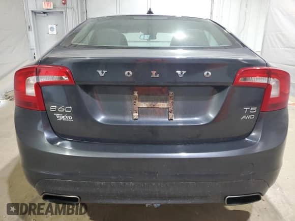 2014 Volvo S60 T5 z VIN YV1612FH6E2276916, wystawiony jako Copart lot #69001855 z przebiegiem 121 441 mil mil oraz Szkoda całkowita • Salvage title. Historia ofert i sprzedaży dostępna na DreamBid. Obrazek 6.