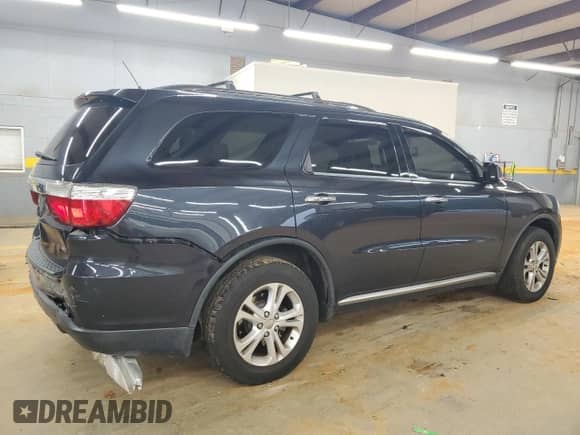 2013 Dodge Durango Crew with VIN 1C4RDJDG9DC682700, listed as a Copart auction lot 68078015 with 169,828 mi miles and Salvage title. Bid and sale history available at DreamBid. Image 3.