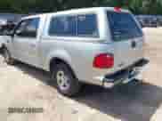 2002 Ford F-150 XLT with VIN 1FTRW07602KB73444, listed as a IAAI auction lot 42744286 with 208,152 mi miles and . Bid and sale history available at DreamBid. Image 3.