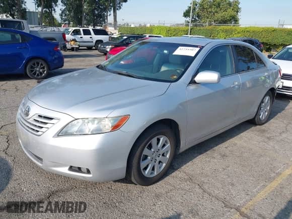 2008 Toyota Camry LE z VIN 4T1BE46K48U770860, wystawiony jako IAAI lot #42755307 z przebiegiem 113 358 mil mil oraz . Historia ofert i sprzedaży dostępna na DreamBid. Obrazek 19.