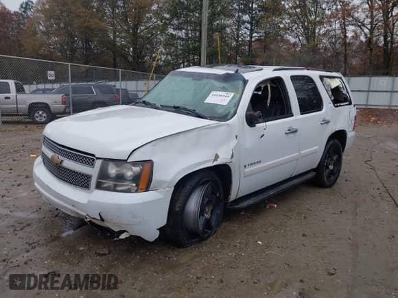2007 Chevrolet Tahoe LT with VIN 1GNFK13047J385192, listed as a IAAI auction lot 41036949 with Not provided miles and . Bid and sale history available at DreamBid. Image 2.