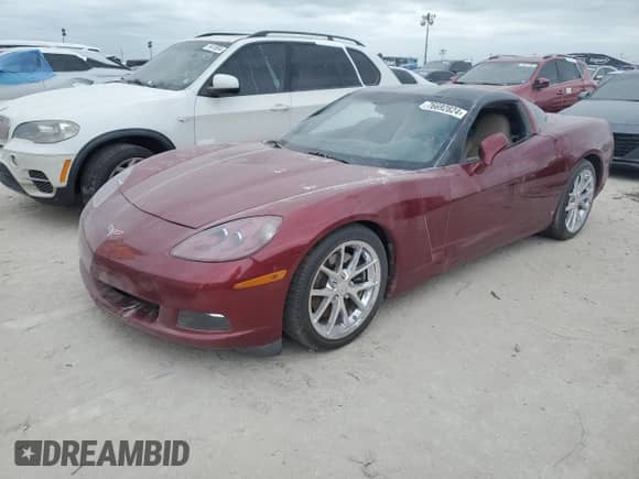 2006 Chevrolet Corvette with VIN 1G1YY26U565100990, listed as a Copart auction lot 76692824 with Not provided miles and Salvage title. Bid and sale history available at DreamBid. Image 1.