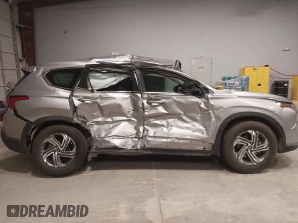 2023 Hyundai Santa Fe SE with VIN 5NMS14AJ6PH648456, listed as a IAAI auction lot 43031344 with 71,840 mi miles and . Bid and sale history available at DreamBid. Image 13.