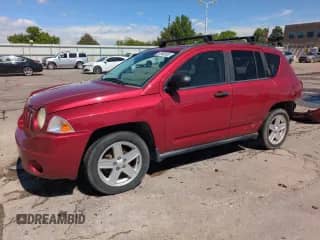2007 Jeep Compass Sport with VIN 1J8FF47W77D584564, listed as a Copart auction lot 57983615 with 214,215 mi miles and Salvage title. Bid and sale history available at DreamBid. Image 1.