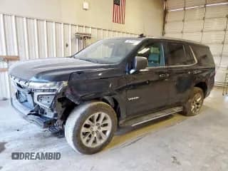 2021 Chevrolet Tahoe Premier z VIN 1GNSKSKDXMR256993, wystawiony jako Copart lot #80742055 z przebiegiem 79 860 mil mil oraz Szkoda całkowita • Salvage title. Historia ofert i sprzedaży dostępna na DreamBid. Obrazek 1.