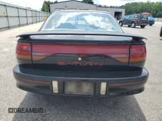 1996 Saturn 2dr Coupe с VIN 1G8ZH1279TZ371071, выставлен на аукционе Copart как лот 66602245 с пробегом 107 563 миль миль и Списание • Salvage title. История ставок и продаж доступна на DreamBid. Изображение 6.