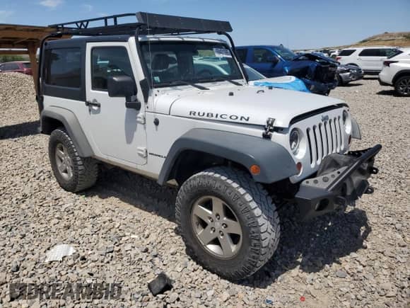 2011 Jeep Wrangler Rubicon with VIN 1J4BA6D12BL535953, listed as a Copart auction lot 59401595 with 77,451 mi miles and Salvage title. Bid and sale history available at DreamBid. Image 4.
