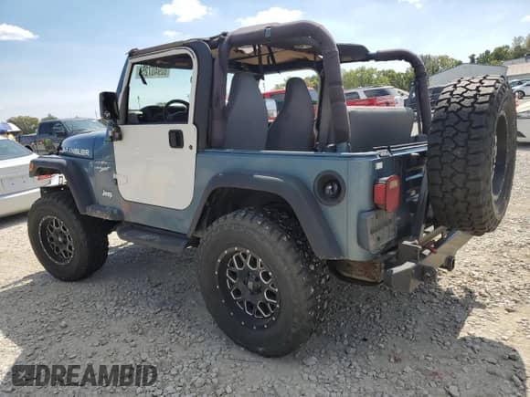 1998 Jeep Wrangler Sport z VIN 1J4FY19S9WP760919, wystawiony jako Copart lot #80940725 z przebiegiem 187 700 mil mil oraz Szkoda całkowita • Salvage title. Historia ofert i sprzedaży dostępna na DreamBid. Obrazek 2.