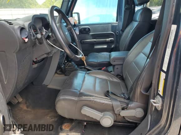 2008 Jeep Wrangler Unlimited Rubicon z VIN 1J4GA691X8L577455, wystawiony jako Copart lot #62909945 z przebiegiem 119 081 mil mil oraz Szkoda całkowita • Salvage title. Historia ofert i sprzedaży dostępna na DreamBid. Obrazek 7.