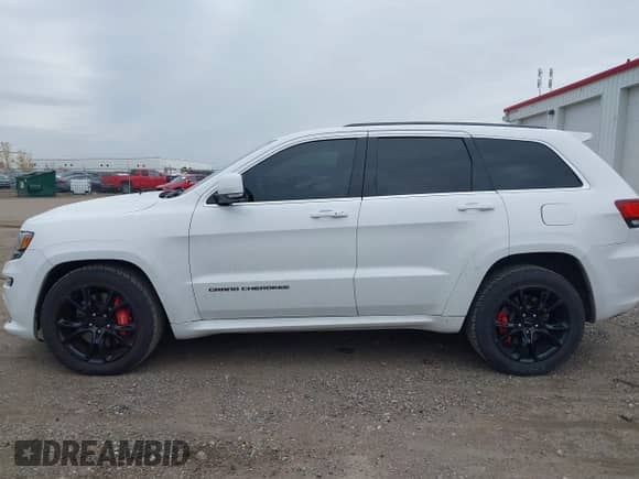 2015 Jeep Grand Cherokee SRT with VIN 1C4RJFDJ4FC882940, listed as a IAAI auction lot 43549108 with 18,901 mi miles and . Bid and sale history available at DreamBid. Image 14.
