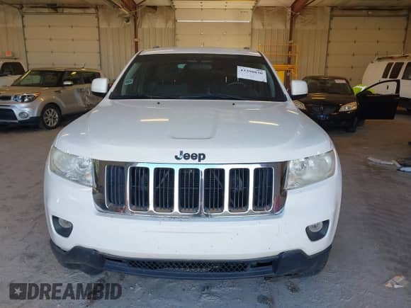 2012 Jeep Grand Cherokee Laredo with VIN 1C4RJFAG8CC141355, listed as a IAAI auction lot 43390830 with 173,259 mi miles and . Bid and sale history available at DreamBid. Image 6.