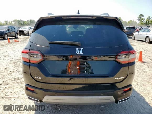 2024 Honda Pilot Touring z VIN 5FNYG1H77RB024994, wystawiony jako Copart lot #80441115 z przebiegiem Nie podano mil oraz Szkoda całkowita • Salvage title. Historia ofert i sprzedaży dostępna na DreamBid. Obrazek 6.