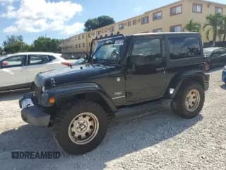 2011 Jeep Wrangler Sahara z VIN 1J4GA5D16BL550388, wystawiony jako Copart lot #82650165 z przebiegiem 197 063 mil mil oraz Czysty tytuł • Clean title. Historia ofert i sprzedaży dostępna na DreamBid. Obrazek 1.
