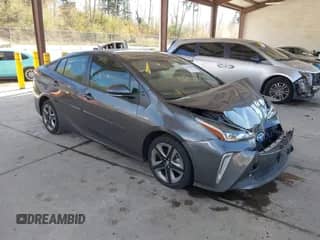 2022 Toyota Prius L Eco with VIN JTDKAMFUXN3155488, listed as a IAAI auction lot 43450434 with 39,407 mi miles and . Bid and sale history available at DreamBid. Image 1.