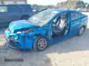 2021 Toyota Prius L Eco with VIN JTDKAMFU1M3136133, listed as a IAAI auction lot 43285926 with 49,911 mi miles and . Bid and sale history available at DreamBid. Image 2.