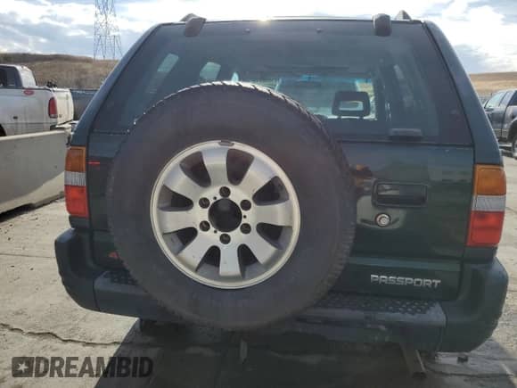 1998 Honda Passport LX with VIN 4S6CM58W2W4403473, listed as a Copart auction lot 66621474 with 154,892 mi miles and Clean title. Bid and sale history available at DreamBid. Image 6.