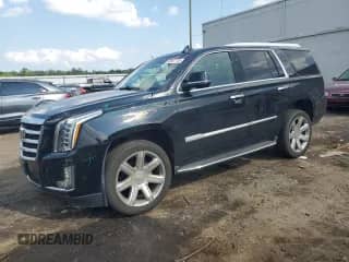 2018 Cadillac Escalade Premium Luxury with VIN 1GYS4CKJ2JR390210, listed as a Copart auction lot 65557135 with 126,413 mi miles and Salvage title. Bid and sale history available at DreamBid. Image 1.