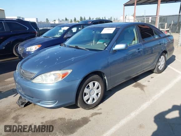 2003 Toyota Camry XLE with VIN 4T1BE32K23U732018, listed as a IAAI auction lot 43388055 with 207,225 mi miles and . Bid and sale history available at DreamBid. Image 2.