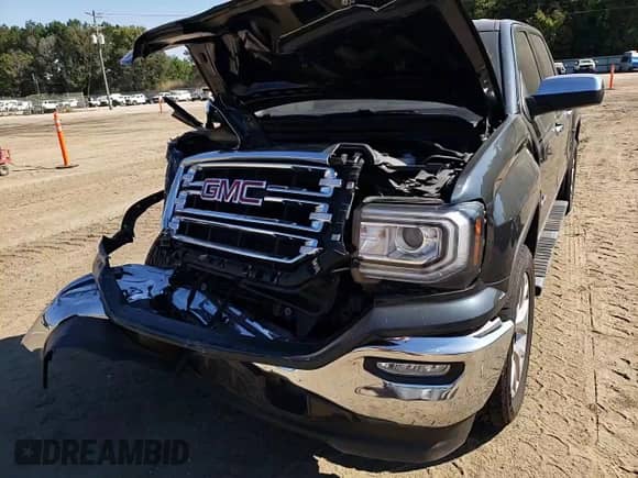 2018 GMC Sierra 1500 SLT z VIN 3GTP1NEC4JG562301, wystawiony jako Copart lot #72045625 z przebiegiem 58 403 mil mil oraz Szkoda całkowita • Salvage title. Historia ofert i sprzedaży dostępna na DreamBid. Obrazek 13.