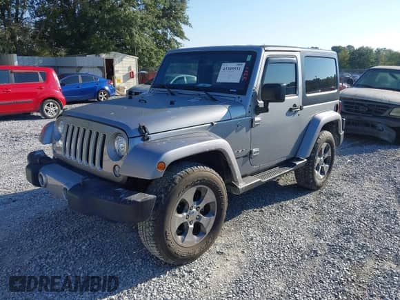 2018 Jeep Wrangler Sahara with VIN 1C4AJWBG5JL895550, listed as a IAAI auction lot 43303531 with 39,755 mi miles and . Bid and sale history available at DreamBid. Image 2.