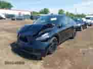 2022 Tesla Model Y Long Range z VIN 7SAYGDEE8NF434074, wystawiony jako IAAI lot #42522198 z przebiegiem 37 469 mil mil oraz . Historia ofert i sprzedaży dostępna na DreamBid. Obrazek 2.