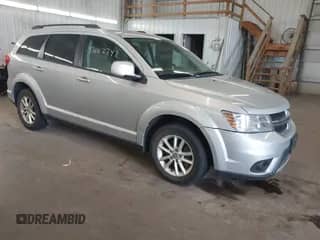 2014 Dodge Journey SXT with VIN 3C4PDCBG9ET270532, listed as a IAAI auction lot 42682742 with 238,129 mi miles and . Bid and sale history available at DreamBid. Image 1.