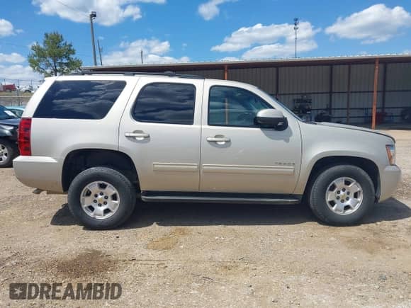 2014 Chevrolet Tahoe LS with VIN 1GNSCAE08ER128141, listed as a IAAI auction lot 42177785 with 108,548 mi miles and . Bid and sale history available at DreamBid. Image 14.