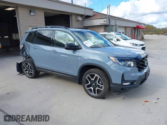 2023 Honda Passport Elite z VIN 5FNYF8H03PB000039, wystawiony jako IAAI lot #40593339 z przebiegiem 33 697 mil mil oraz . Historia ofert i sprzedaży dostępna na DreamBid. Obrazek 1.