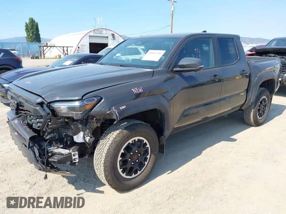 2024 Toyota Tacoma TRD Off Road with VIN 3TMLB5JN7RM069938, listed as a IAAI auction lot 43056789 with 6,837 mi miles and . Bid and sale history available at DreamBid. Image 2.