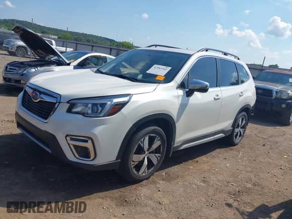 2020 Subaru Forester Touring with VIN JF2SKAXCXLH493203, listed as a IAAI auction lot 42983342 with 109,124 mi miles and . Bid and sale history available at DreamBid. Image 2.