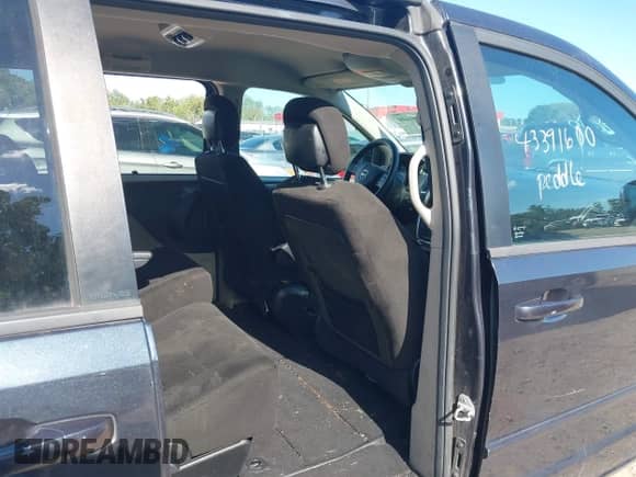 2013 Dodge Grand Caravan SXT with VIN 2C4RDGCG3DR590655, listed as a IAAI auction lot 43391600 with 189,771 mi miles and . Bid and sale history available at DreamBid. Image 8.