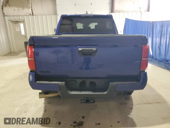2024 Toyota Tacoma TRD Off Road with VIN 3TMLB5JN6RM026286, listed as a Copart auction lot 81666825 with 27,497 mi miles and Salvage title. Bid and sale history available at DreamBid. Image 6.